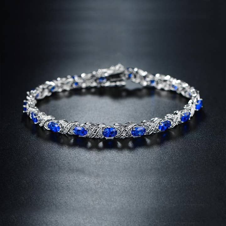 Lab-Created Blue Sapphire and Diamond Accent Tennis Bracelet for wholesale by Golden NYC Jewelry