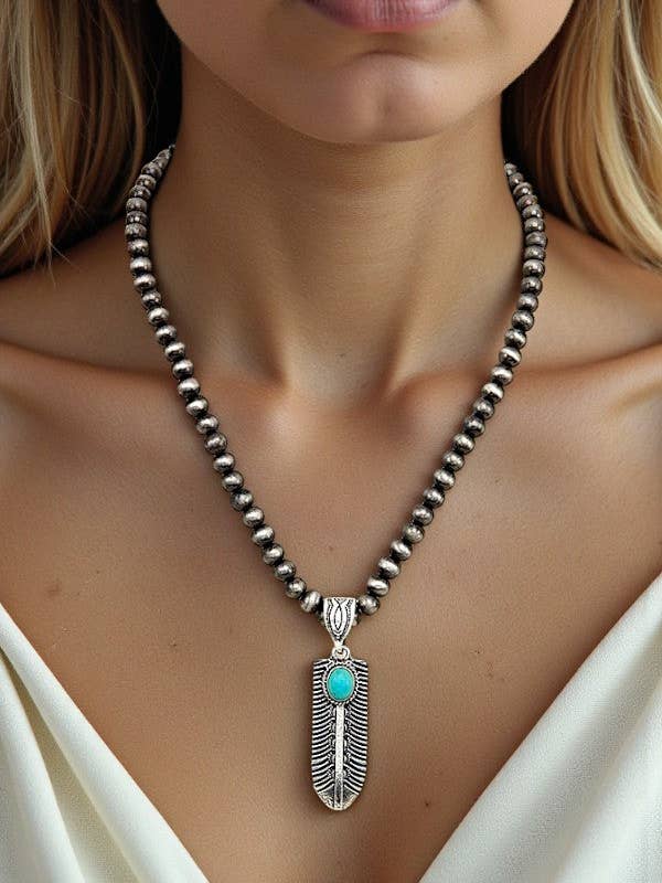 CONJUNTO DE COLLAR DE PERLAS NAVAJO CON COLGANTE DE PLUMA GRABADA para venta al por mayor de Andrea Bijoux