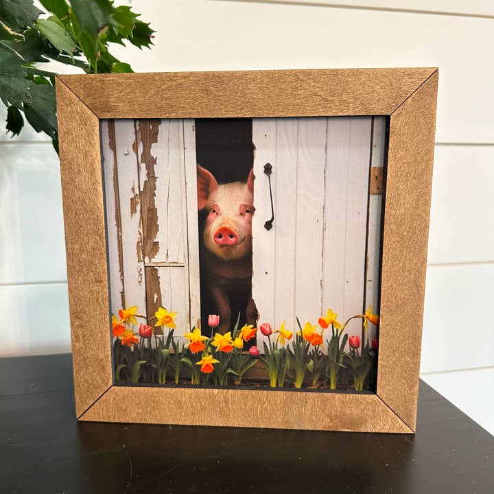 8.5” Framed Piglet Peeking from Barn Door for wholesale by Farmhouse Decor & Co.