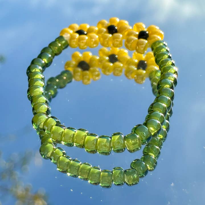 Glaspärlring "Sunny" med 3 solrosor för wholesale av cool people club