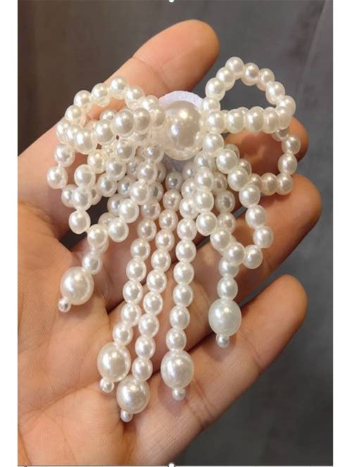 CLASSIC PEARL BOW RIBBON SHOE CHARM | 40SD100 for wholesale on Faire