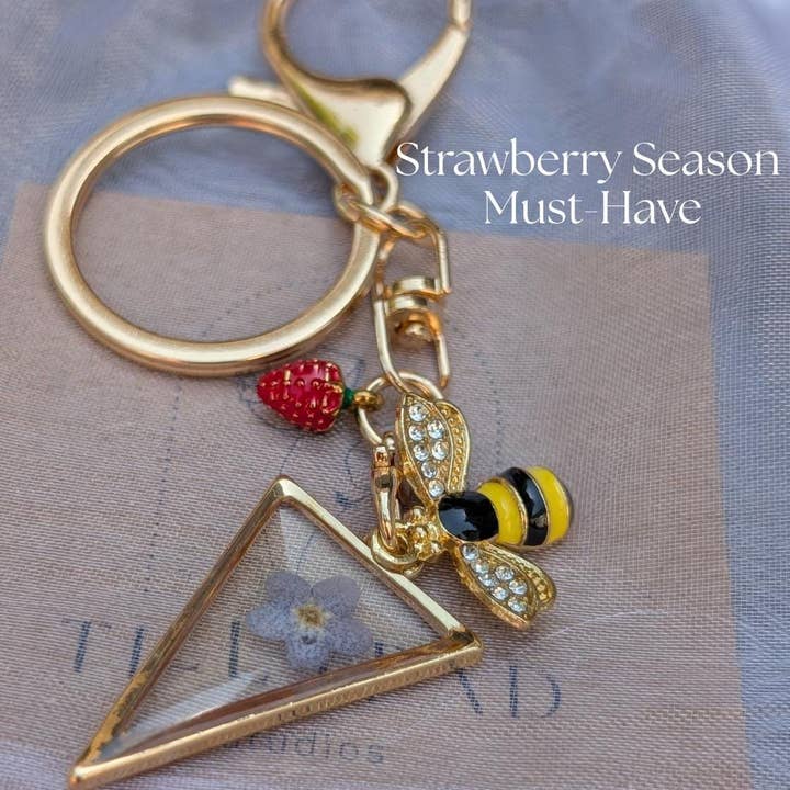 Bee Charm Keychain Pressed Flower Triangle Keychain Gold Key Ring Strawberry Charm Nature Gift for Her Cottagecore Bag Charm Fairycore Gift for wholesale by TillyPad Studios