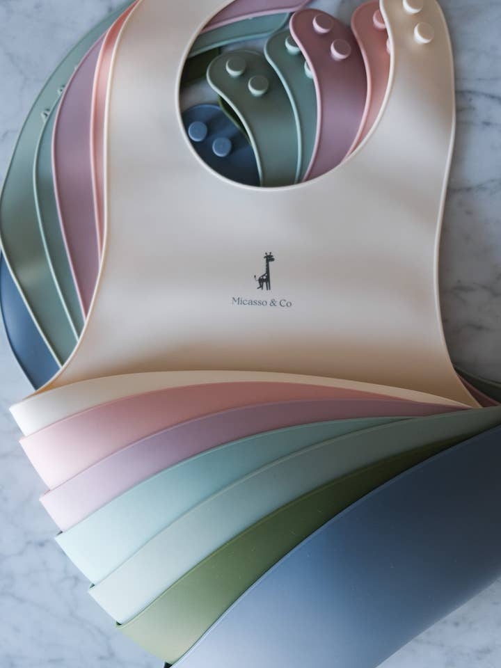 Adjustable silicone bib for wholesale by Micasso & Co