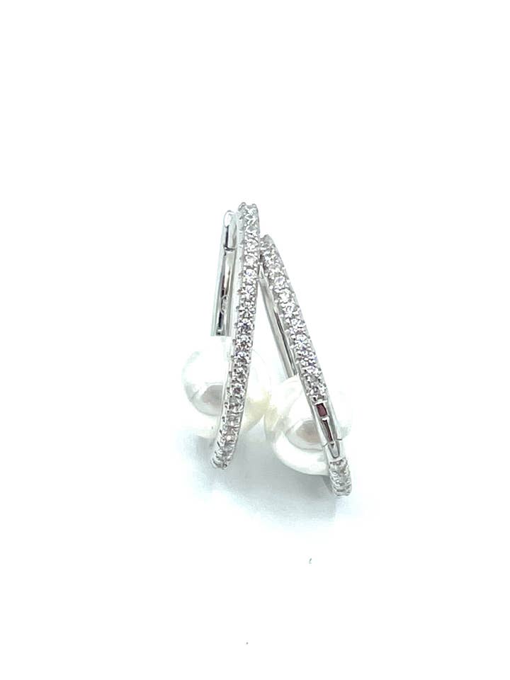 Roues argentées Tit. 925M. Avec zircone et perle pour la vente par Tererò s.r.l.