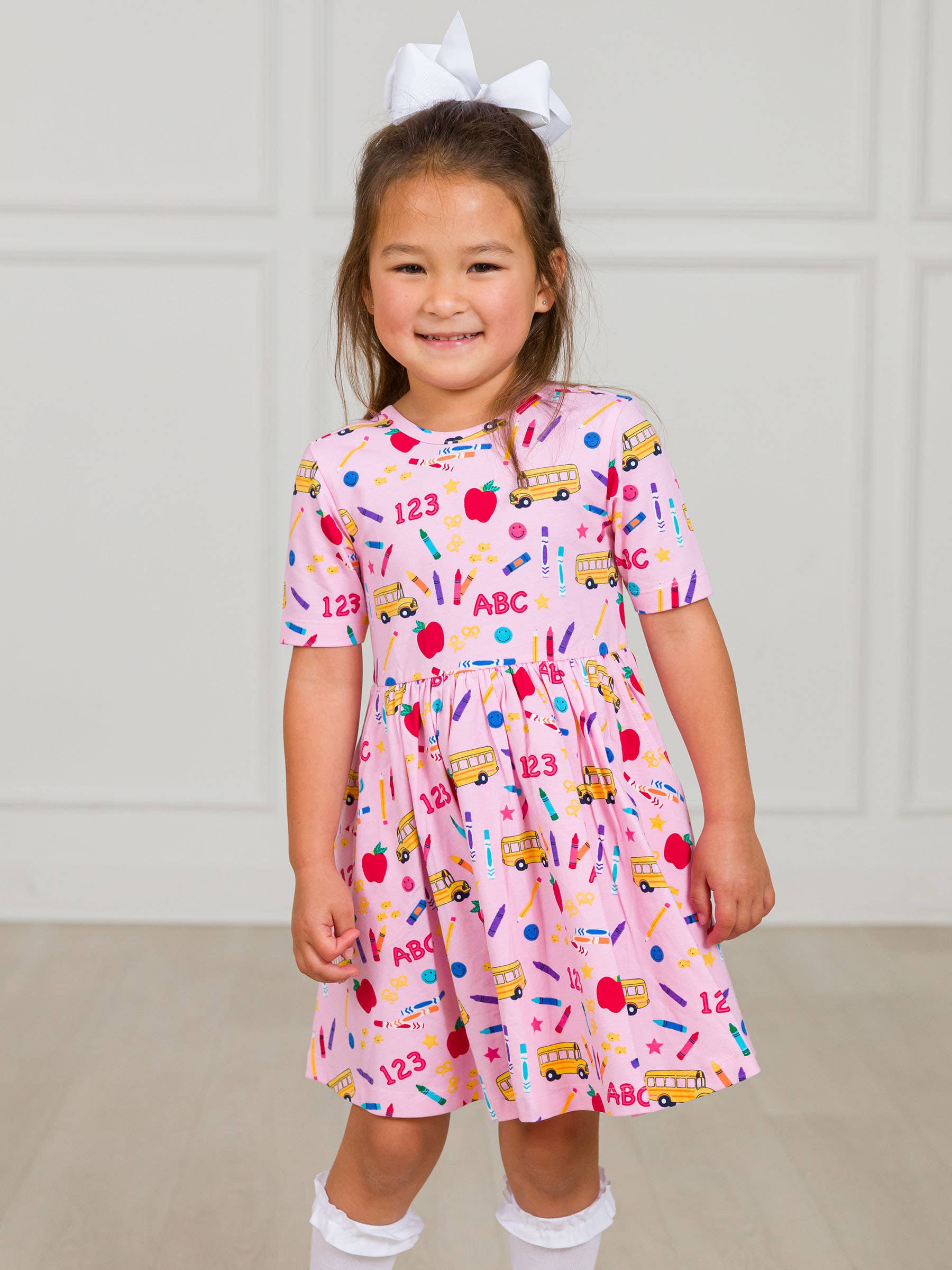 Lyserød Pigers lyserøde skolehus kortærmet strikket snurrekjole for engroshandel på Faire1