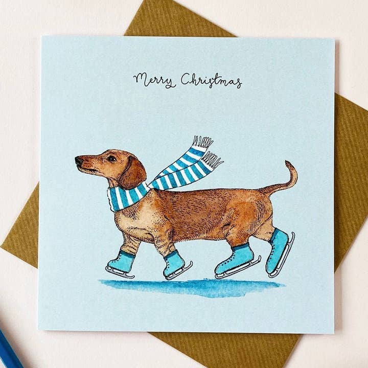 Festive Dachshund/Sausage Dog Christmas Card for wholesale by Amelia Illustration