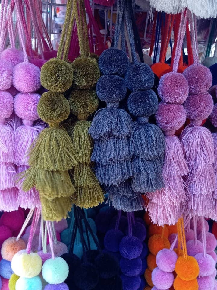 Pom Pom Tassel bag Charm for wholesale by The Faria