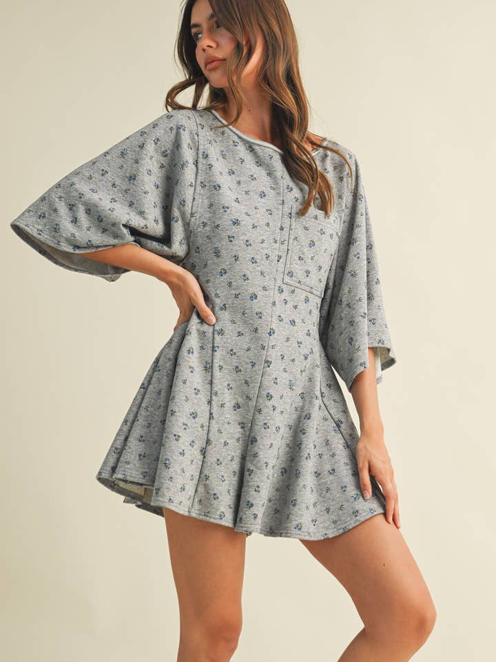 IR2212-A FLORAL FRONT POCKET GODET FLOWY ROMPER for wholesale by Klesis