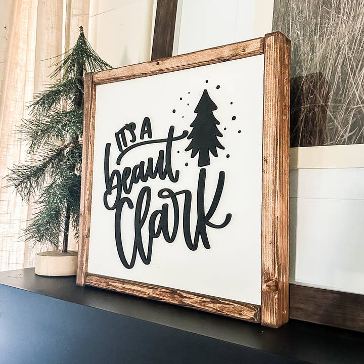 It's a Beaut Clark Christmas Wood Sign for wholesale by Dakota + Pine Design Co.