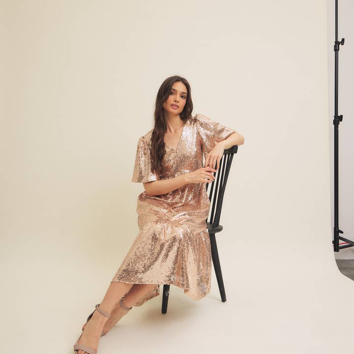 CHAMPAGNE SPARKLING LONG SLEEVED SEQUIN MIDI DRESS for wholesale on Faire