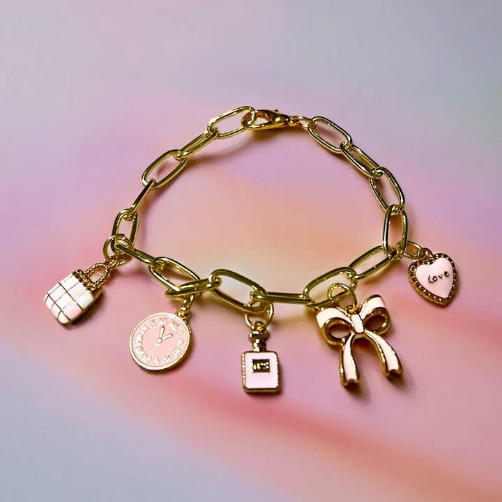 Bracelet à breloques rose tendre pour la vente par Supr Nova Wrists