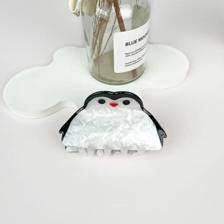 White Acrylic penguin animal hair claw clip for wholesale on Faire1