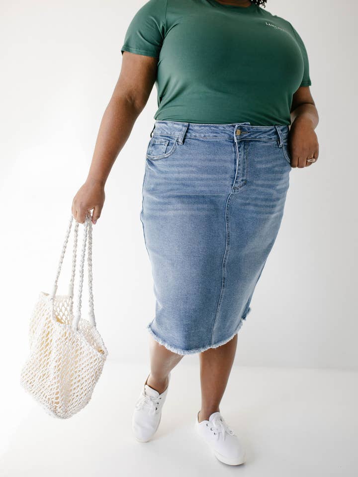 'Nala' Distressed Denim Skirt and other Purchase Wholesale apparella. Free Returns & Net 60 Terms on Faire trending on Faire.