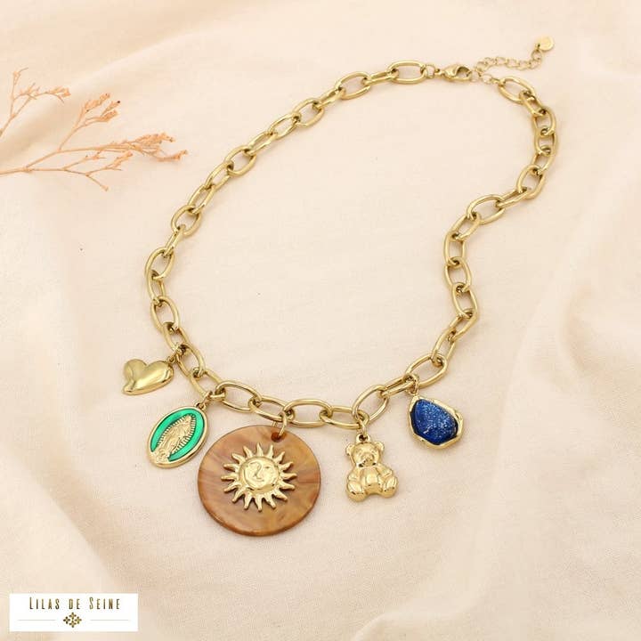 Collana in acciaio con ciondoli sole cuore medaglione orsetto 0125509 per la vendita all'ingrosso da parte di Lilas de Seine