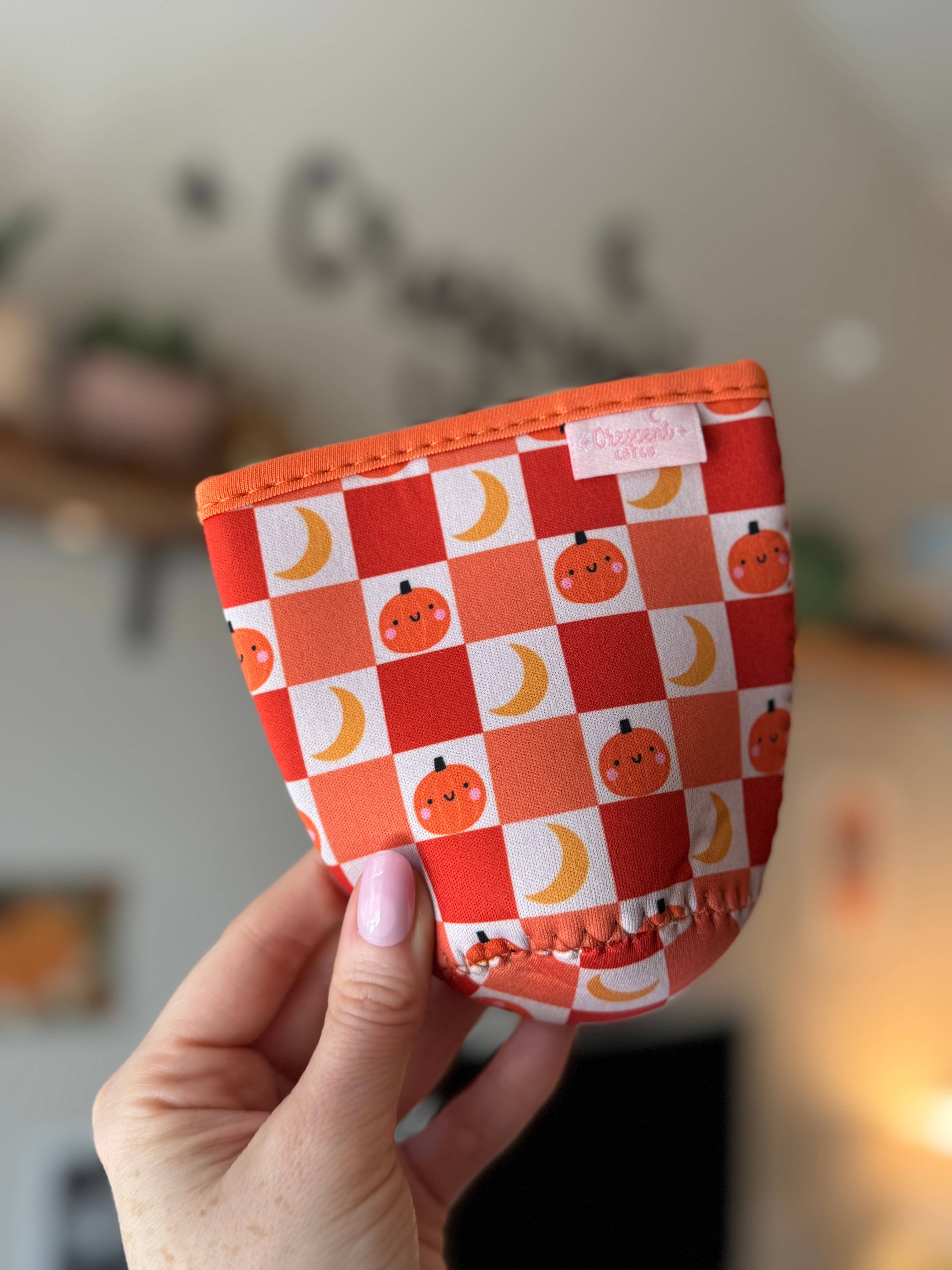CrescentCatCo - Wholesale Drink Huggers & Koozies - Pumpkin Checkered Spooky Iced Coffee Drink Sleeve (Copy)3