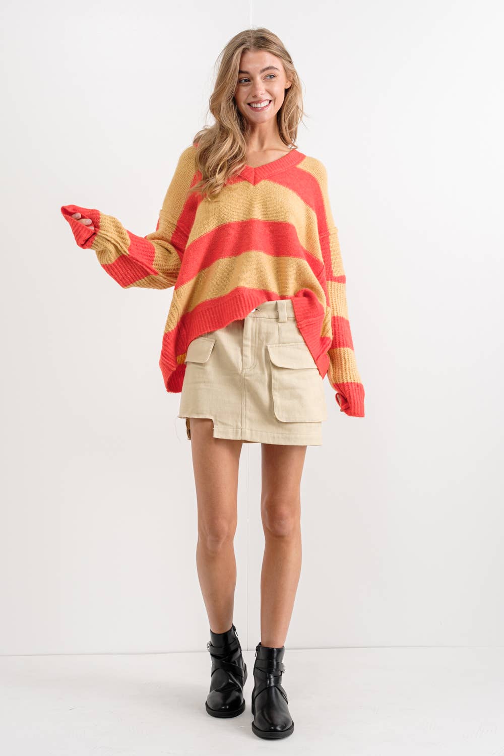 ARANCIO/TORTORA MAGLIONE DOLMAN OVERSIZE A RIGHE CON SCOLLO A V in vendita all'ingrosso su Faire1