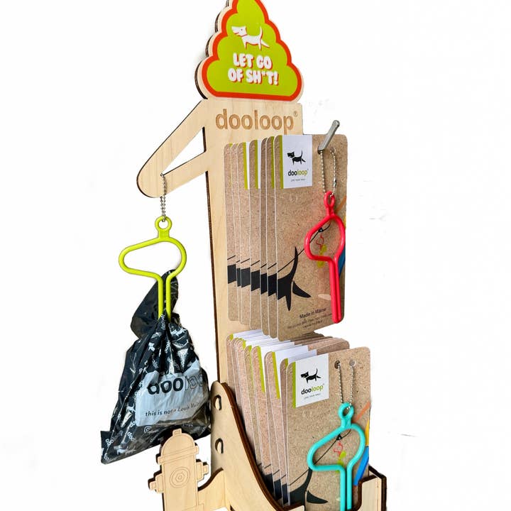 Tall wooden display unit with hydrant that holds 30 dooloops for wholesale by The dooloop by Houndswag LLC