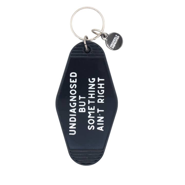 Hot Stamped Motel Keychain Something Ain't Right for wholesale by Properly Improper