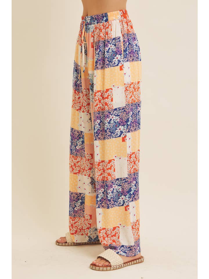 DENIM MULTI SOFT RAYON GAUZE FLORAL PATCHWORK WIDE LEG PANTS WITH POCKET for wholesale on Faire
