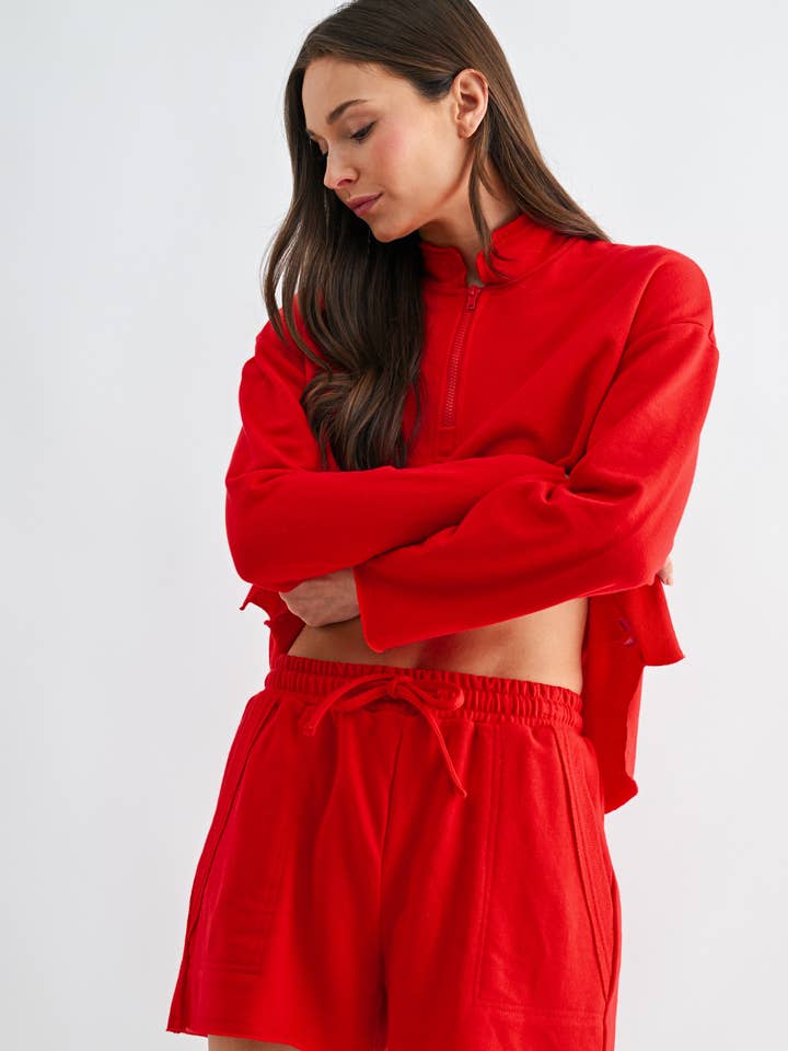 Ensemble à demi-fermeture éclair avec bord brut décalé pour la vente par Mono B