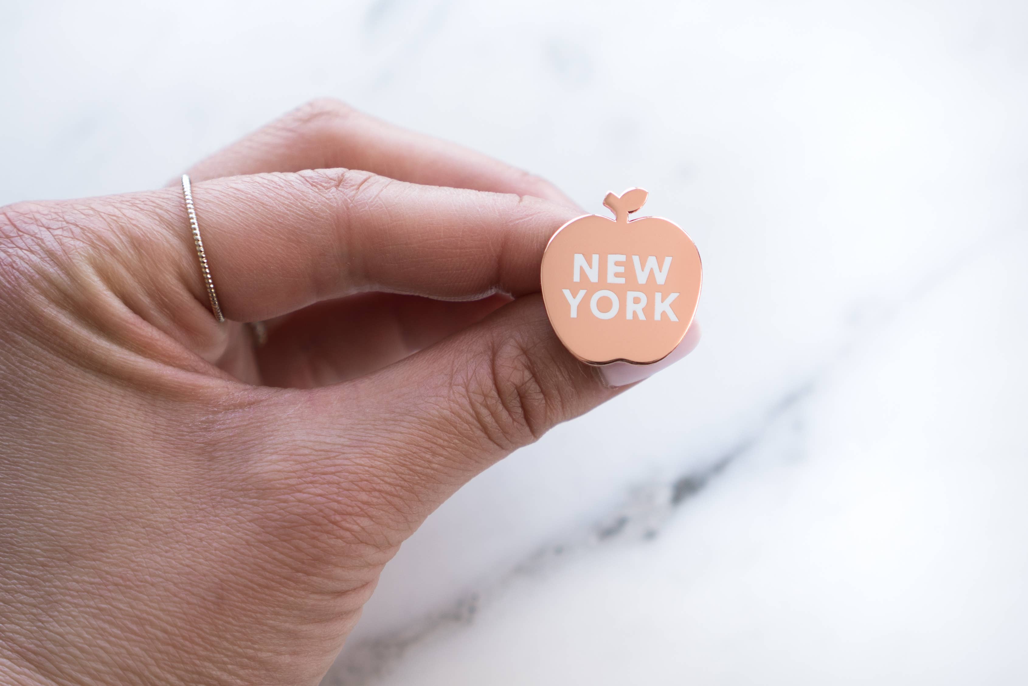 Gold black New York Apple Pin for wholesale on Faire2