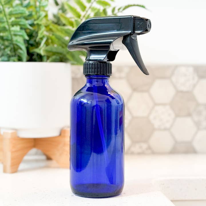 8oz Empty Blue Glass Spray Bottle for wholesale by Matrix Aromatherapy