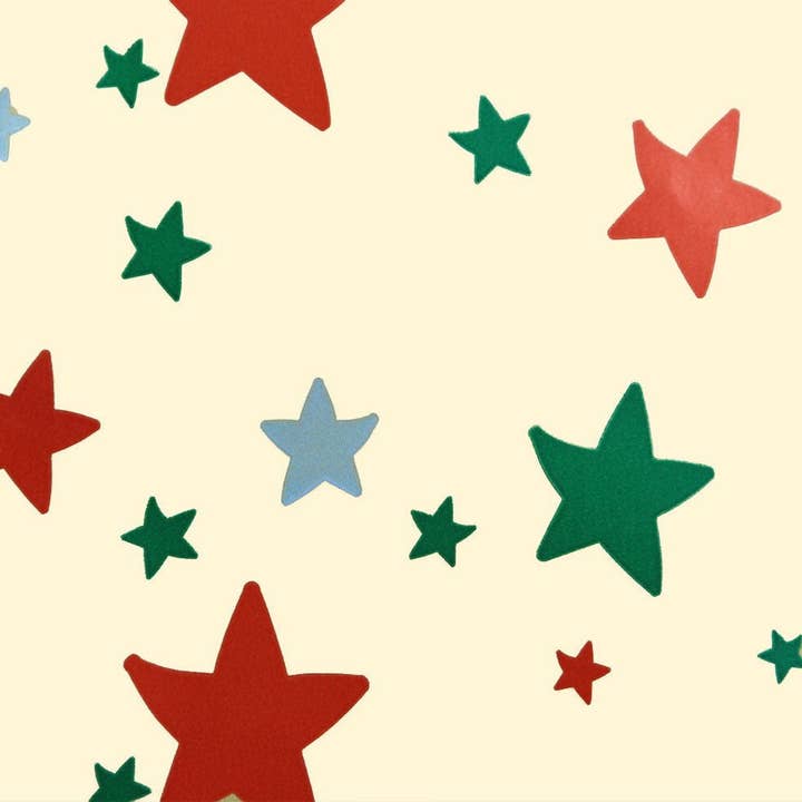 Stelle di carta da regalo natalizia su avorio per la vendita all'ingrosso da parte di kadopapier.net