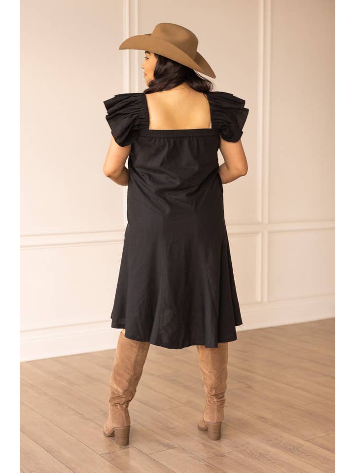 The Stella Black Linen Versi Dress for wholesale on Faire