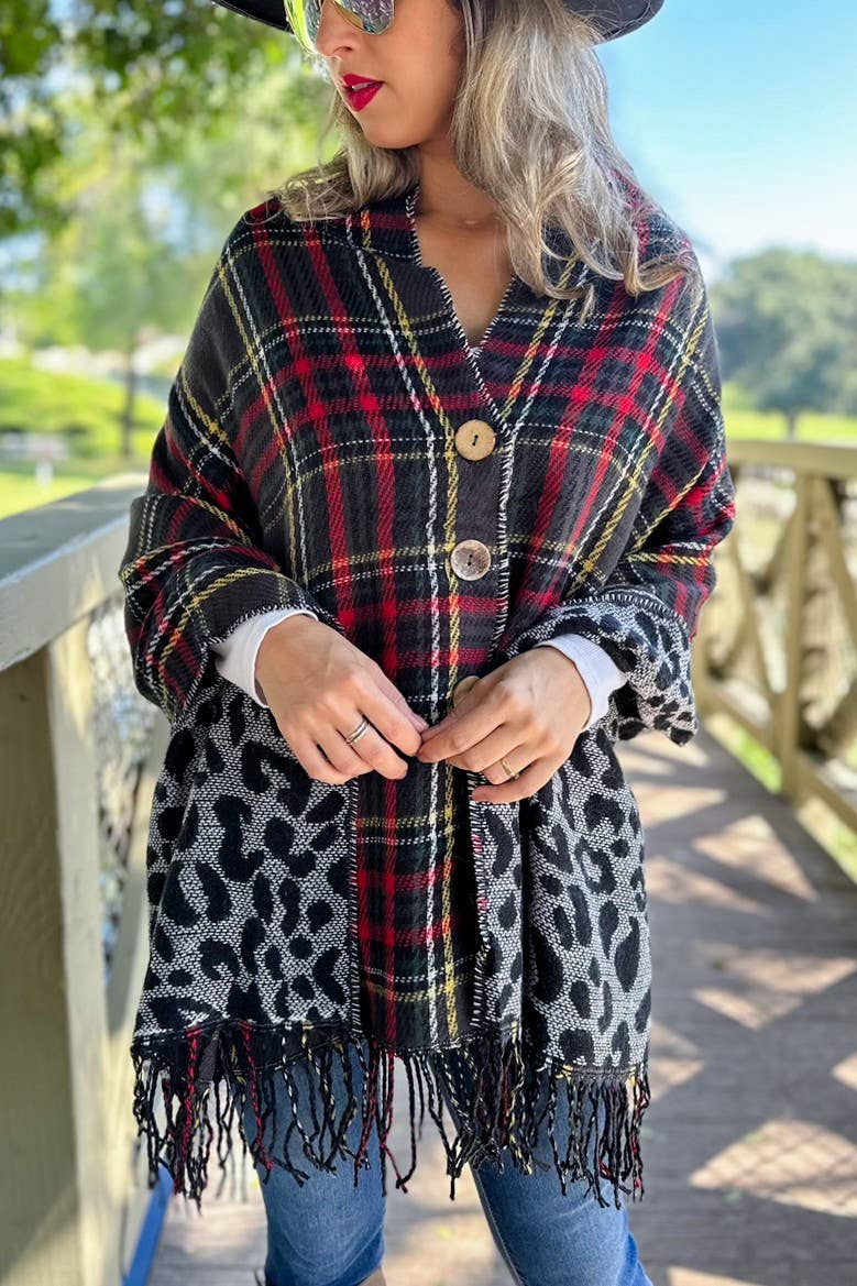 Nero Poncho reversibile bifacciale nero e leopardato con bottone in vendita all'ingrosso su Faire1