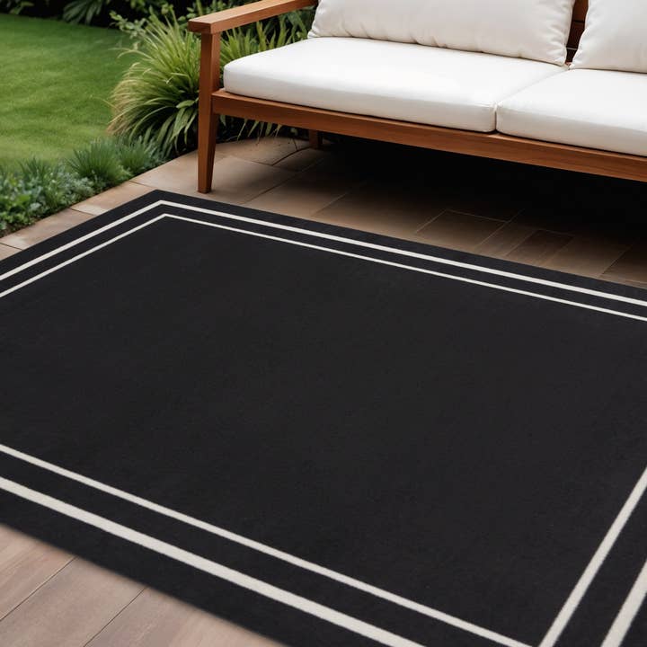 9' X 12' Black And Ivory Indoor Outdoor Area Rug for wholesale by HomeRoots