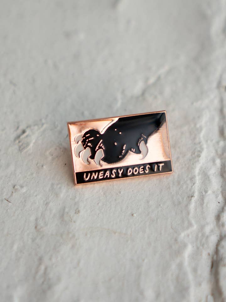 Uneasy Does It Pin | Black Cat Claws Lapel Pin for wholesale by Stay Home Club