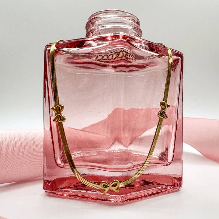 Mini Bow Accent Snake Chain Bracelet – Gold Plated & Waterproof and other Purchase Wholesale things that go. Free Returns & Net 60 Terms on Faire trending on Faire.