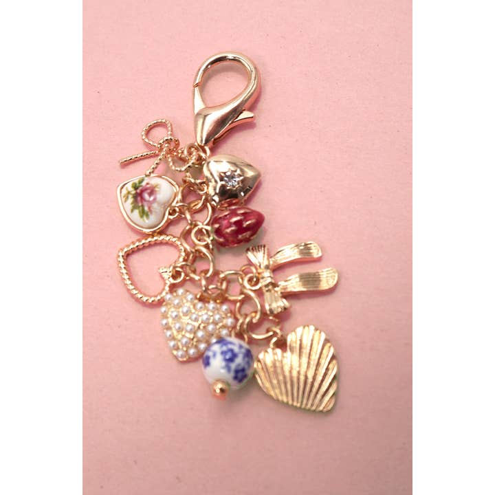 Gold PORCELAIN BOWS HEARTS PEARL STRAWBERRY BAG CHARM | 80K008 for wholesale on Faire