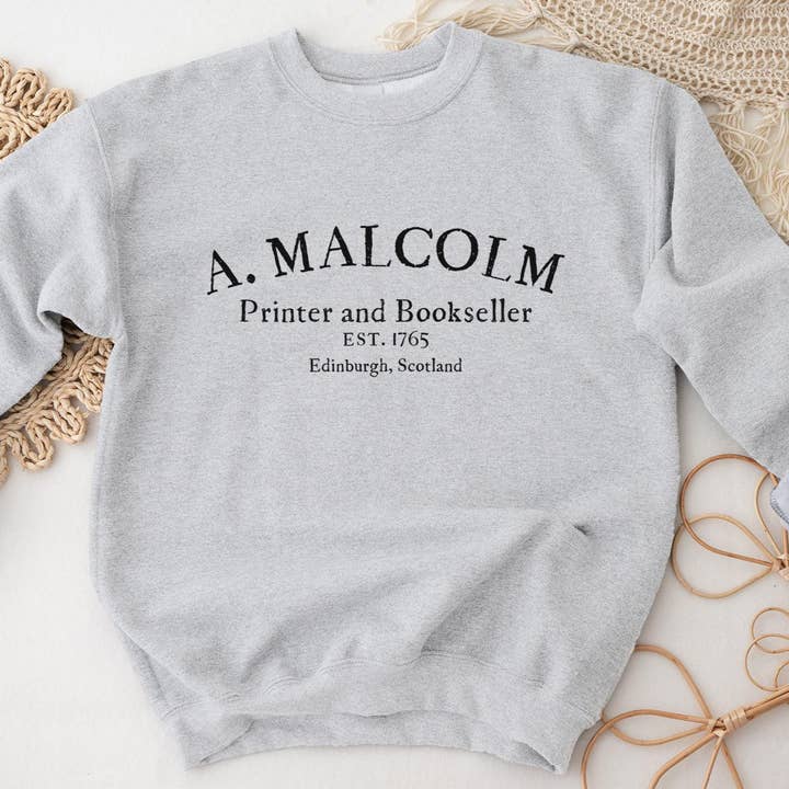 A Malcolm Printer and Bookseller Sweatshirt for wholesale by Painted Lavender