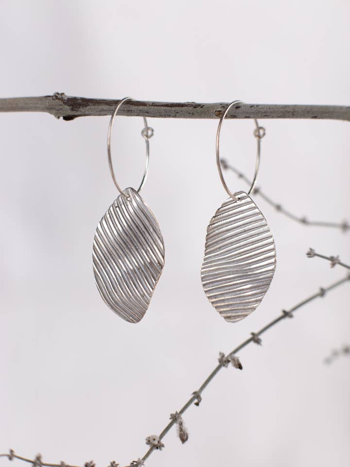 Wavy striped hoop, sterling silver earrings for wholesale by Tina Welsch Jewelry