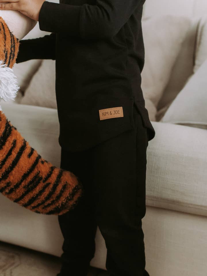 Black bamboo grow-with-me sweater for wholesale by Kim & Joe