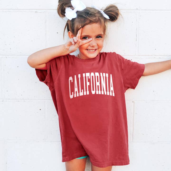 Custom Comfort Colors Kids Tee With Your Name Location Logo for wholesale by Peculiar People Designs