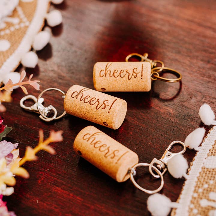 Cheers Wine Cork Keychains - Purse or Handbag Accessory and other Purchase Wholesale wine keys. Free Returns & Net 60 Terms on Faire trending on Faire.