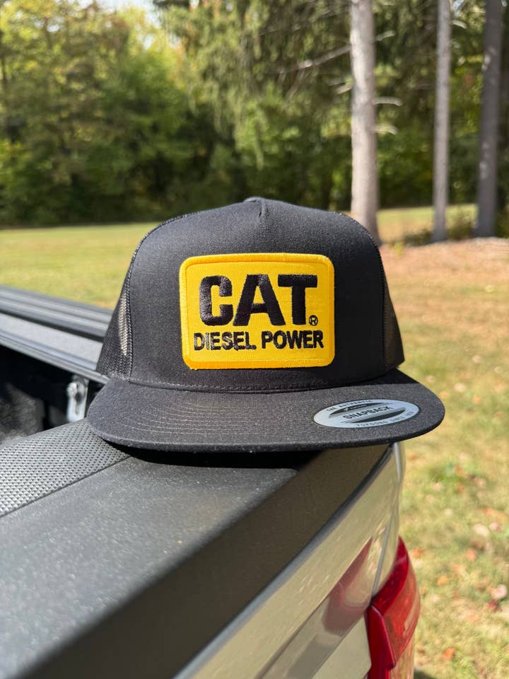 CAT Black Snapback for wholesale by River Bent Hat Co.