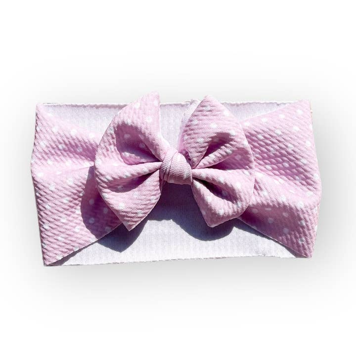 Nœud bandeau à pois violet pour la vente par Tiny toes Baby Co