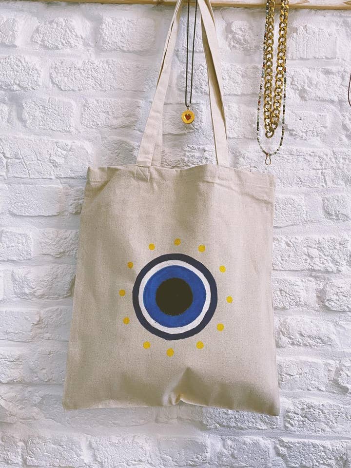Tote bag mauvais œil pour la vente par Nicole Cavallaro