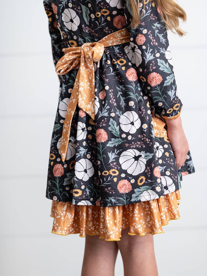 Oopsie Daisy - Wholesale Dress - Kids - Girls Mustard Pumpkin Ruffle Pocket Button Tie Fall Dress2