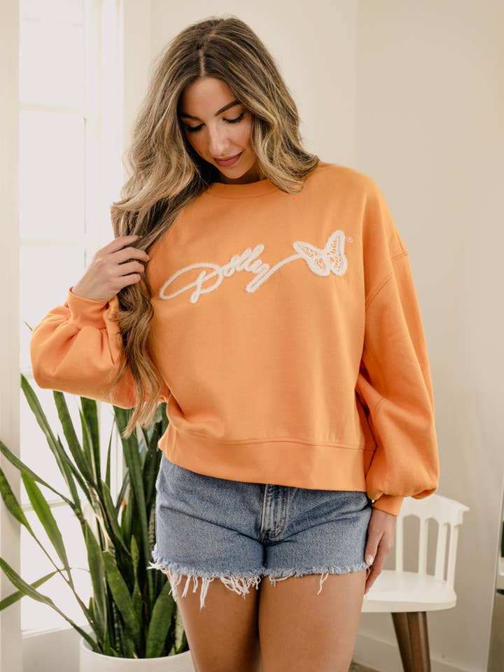 Dolly Parton Tinsel Orange Hi-Dive Sweatshirt for wholesale by LivyLu