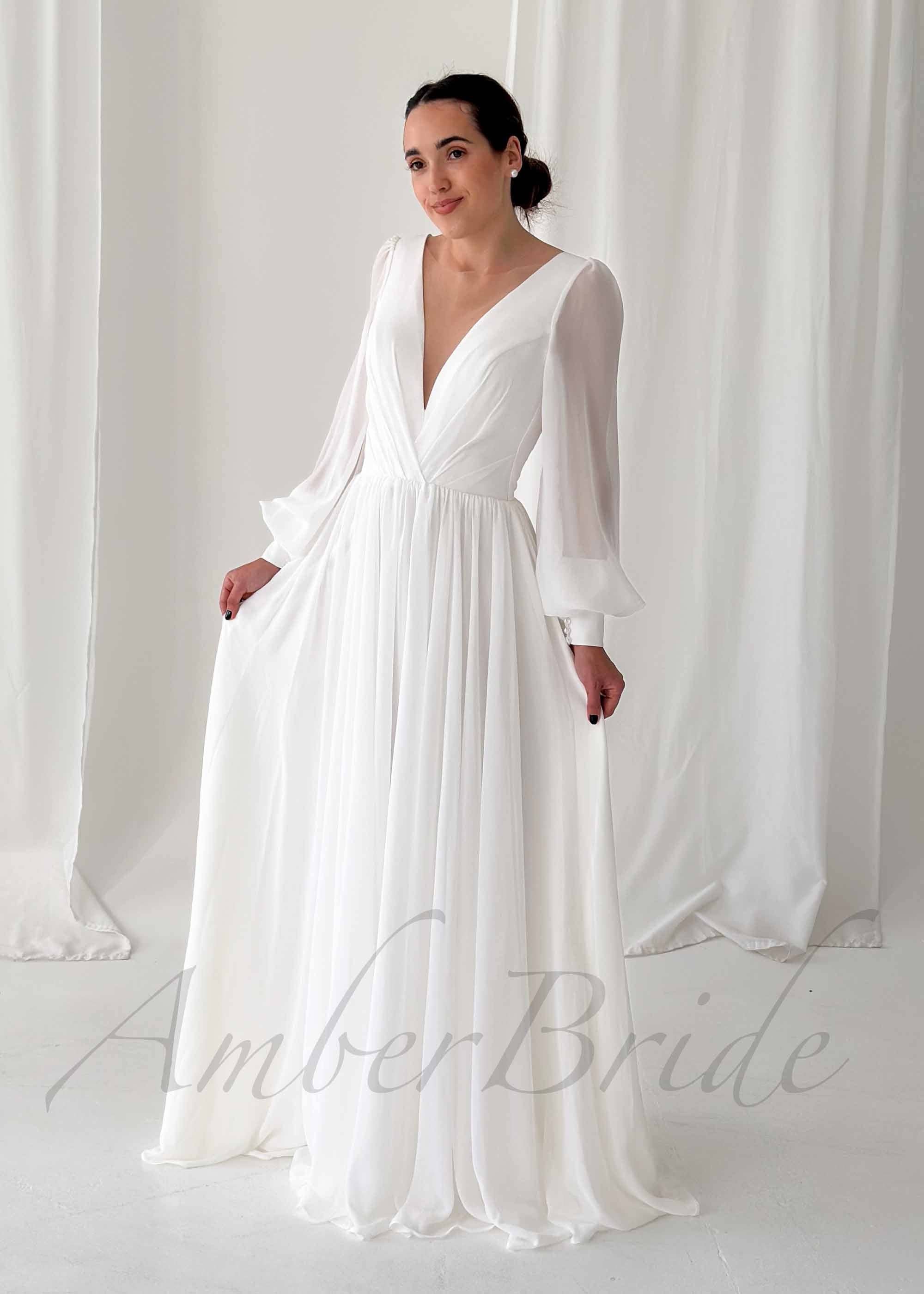 Amber Commerce Group, MB - Wholesale Gown - Women's - Classy A Line Wedding Dress with Deep V Neckline and Long Sleeves0
