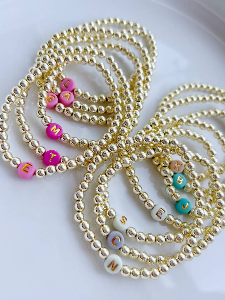 Bright Gold Initial Bracelets for wholesale by Designed by Emily Ann