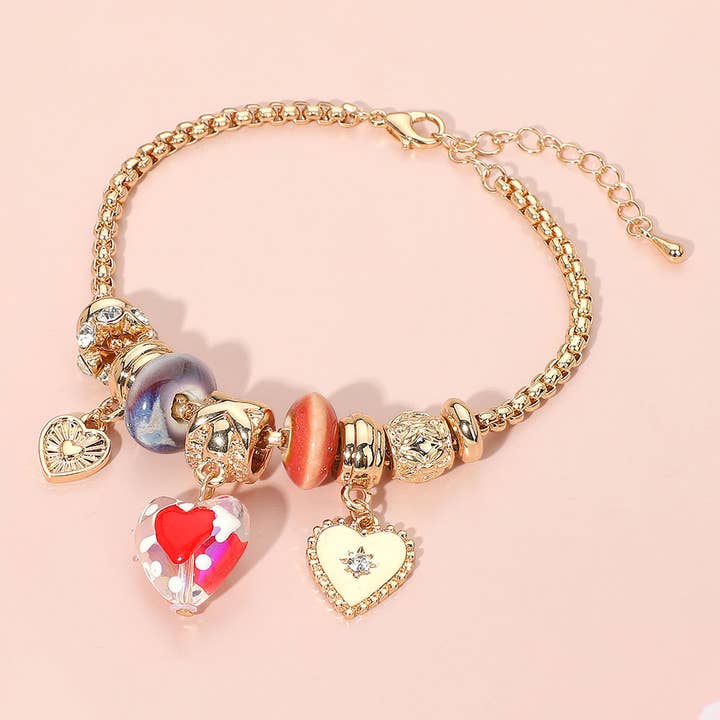 Romantic Triple Heart Charm Multi Bead Bracelet for wholesale by Sensibling Corp.