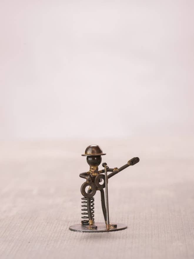 Handmade Recycled Rustic Metal Guitar Player Figurine 4" for wholesale by Spectrum Home Fashions, Inc.