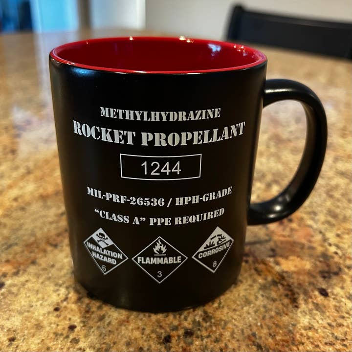 The Rocket Propellant Coffee Mug for wholesale by Red Planet Resorts LLC