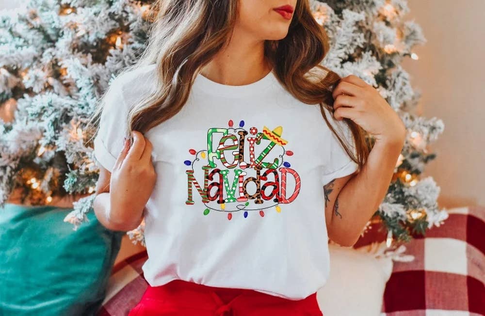 Black Feliz Navidad Shirt, Navideño Tees, Spanish Merry Christmas for wholesale on Faire0