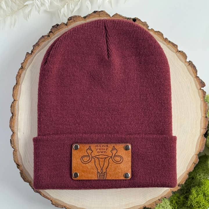 Mind Your Own Uterus beanie with snap on/off leather patch for wholesale by The Lonely Pine